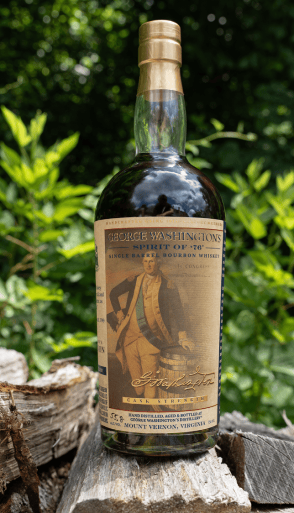 A bottle of George Washington's Spirit of '76 single barrel bourbon whiskey, featuring a historic label with an image of George Washington and surrounded by green foliage.